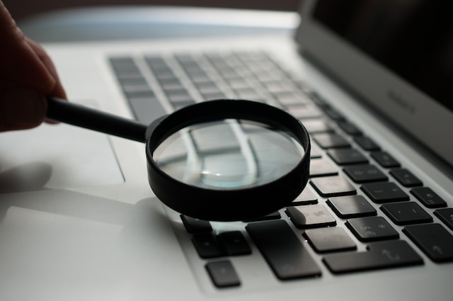 photo of a magnifying glass on a laptop