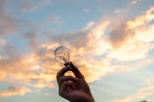 Lightbulb against sky